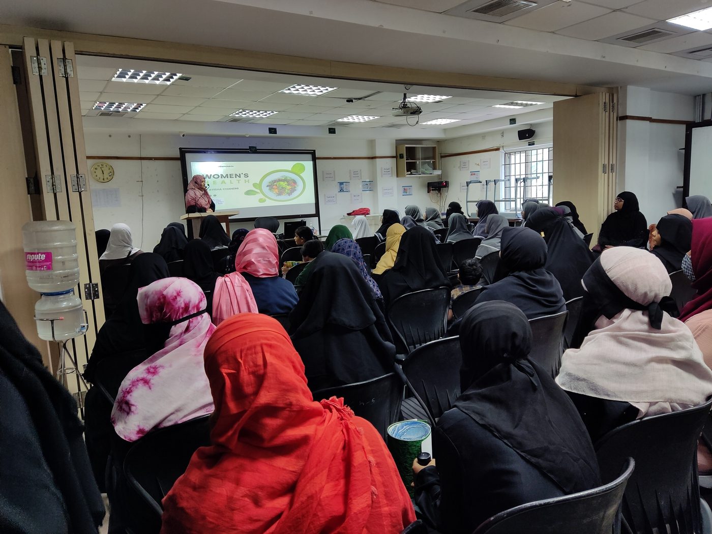 Ayisha Chandni speaking on women's health to a full room